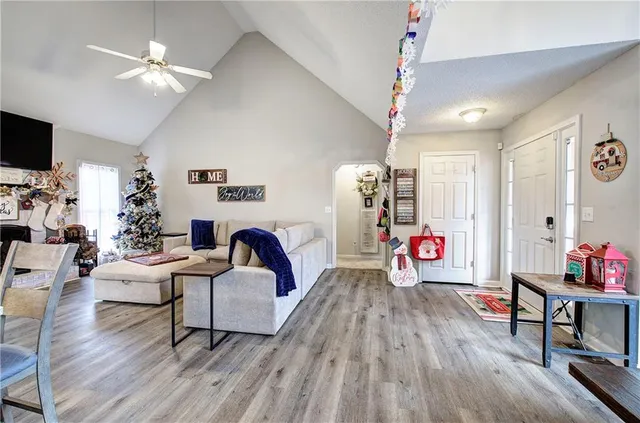 a living room with furniture and wooden floor