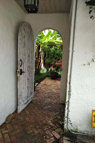 a view of a livingroom with furniture and staircase
