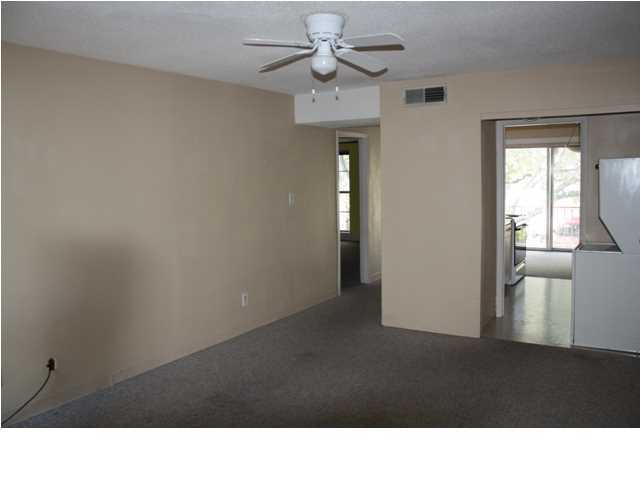 210 Pelham Road, Unit A207 Fort Walton Beach, FL 32547 - Photo 2 of 10 a black and white wall with window in an empty room