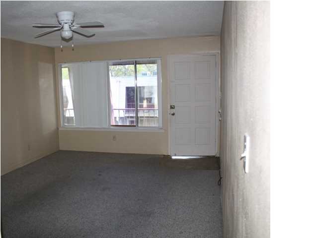 210 Pelham Road, Unit A207 Fort Walton Beach, FL 32547 - Photo 3 of 10 a view of an empty room with a window