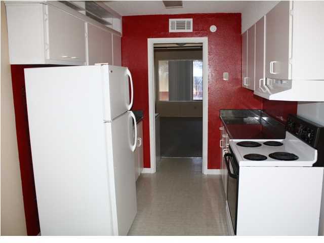 210 Pelham Road, Unit A207 Fort Walton Beach, FL 32547 - Photo 4 of 10 a utility room with dryer and washer