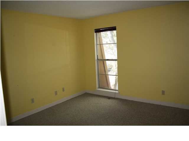 210 Pelham Road, Unit A207 Fort Walton Beach, FL 32547 - Photo 7 of 10 a black and white wall with a window