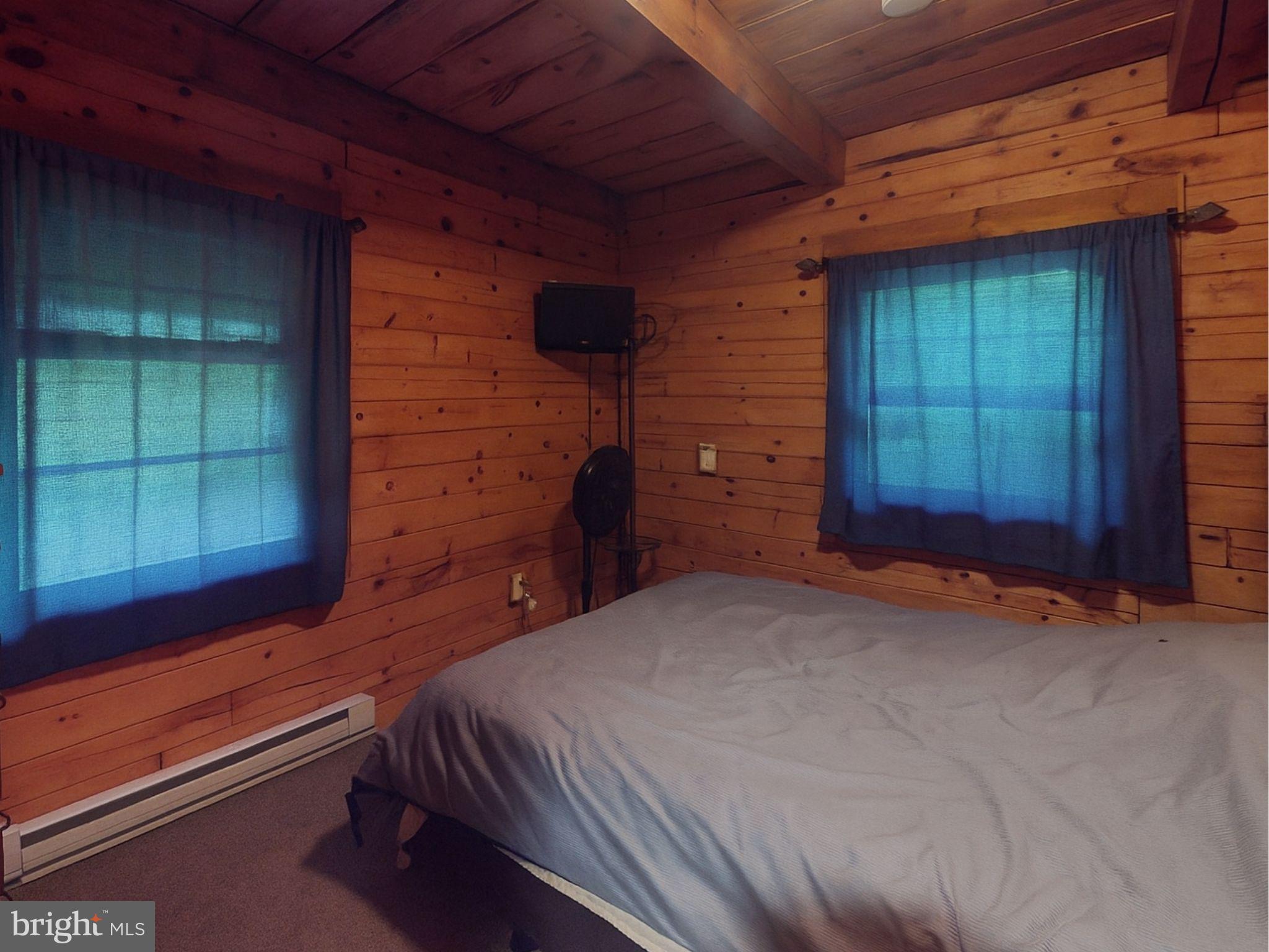 12860 Corbin Road Huntingdon, PA 16652 - Photo 4 of 9 a bedroom with a bed and a window