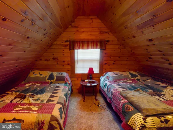 a bedroom with bed and a window