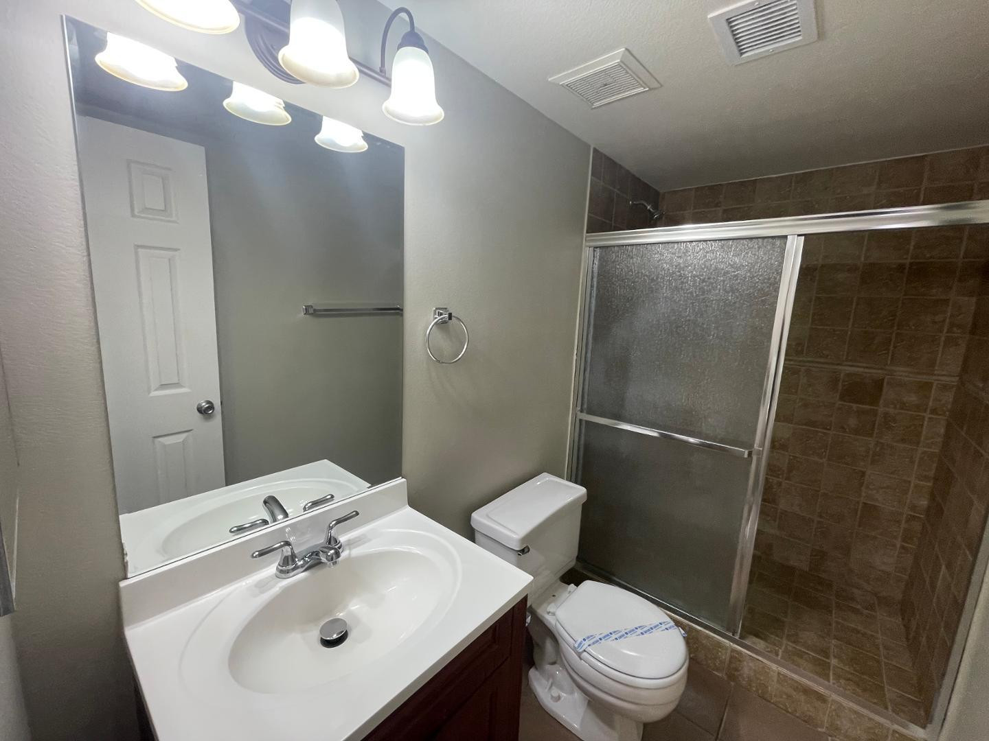 10902 West Montecito Avenue Phoenix, AZ 85037 - Photo 16 of 22 a bathroom with a sink toilet and shower