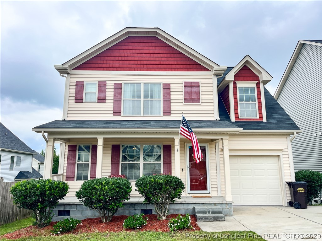 front view of brick house with potted plants
