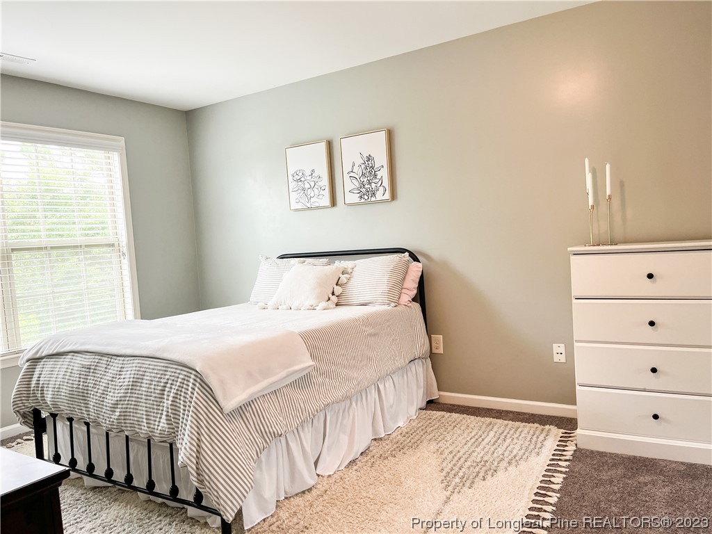 52 Expedition Drive Cameron, NC 28326 - Photo 12 of 19 a bedroom with a bed and a window