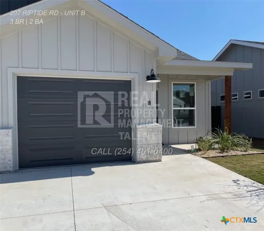 a front view of a house with garage