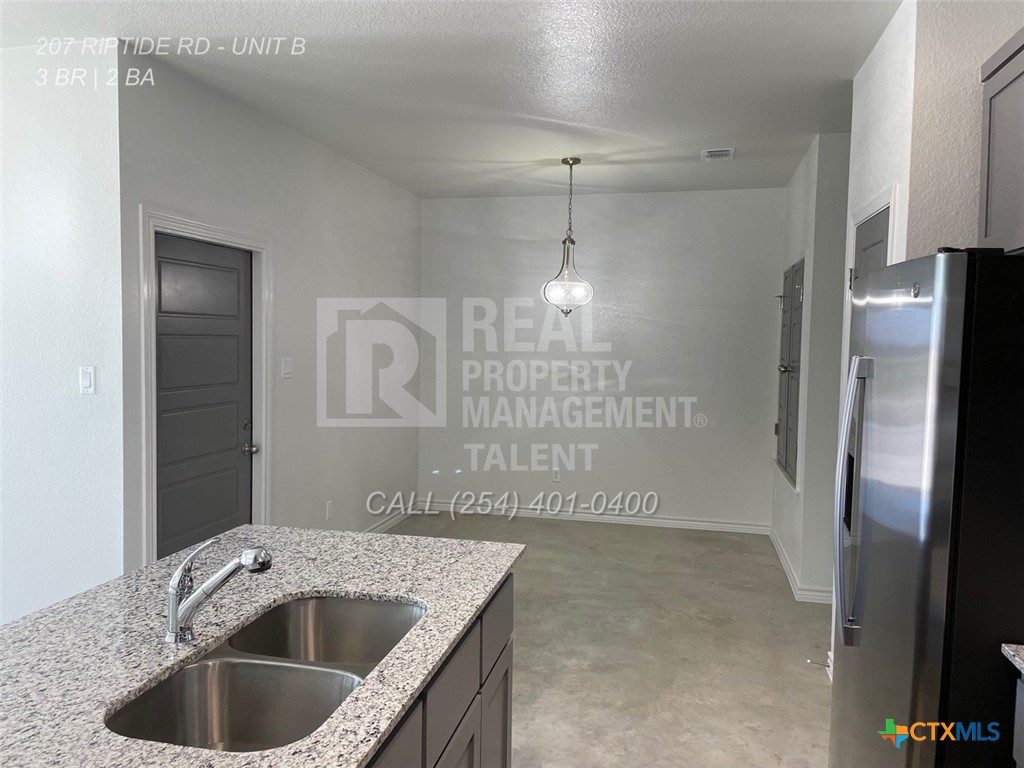 207 Riptide Road Temple, TX 76501 - Photo 2 of 13 a view of a kitchen counter a sink and refrigerator