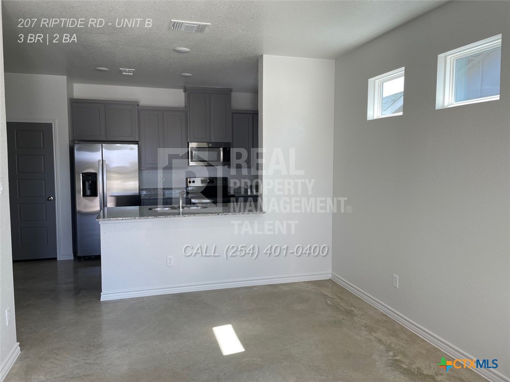 207 Riptide Road Temple, TX 76501 - Photo 6 of 13 a view of kitchen with refrigerator and window