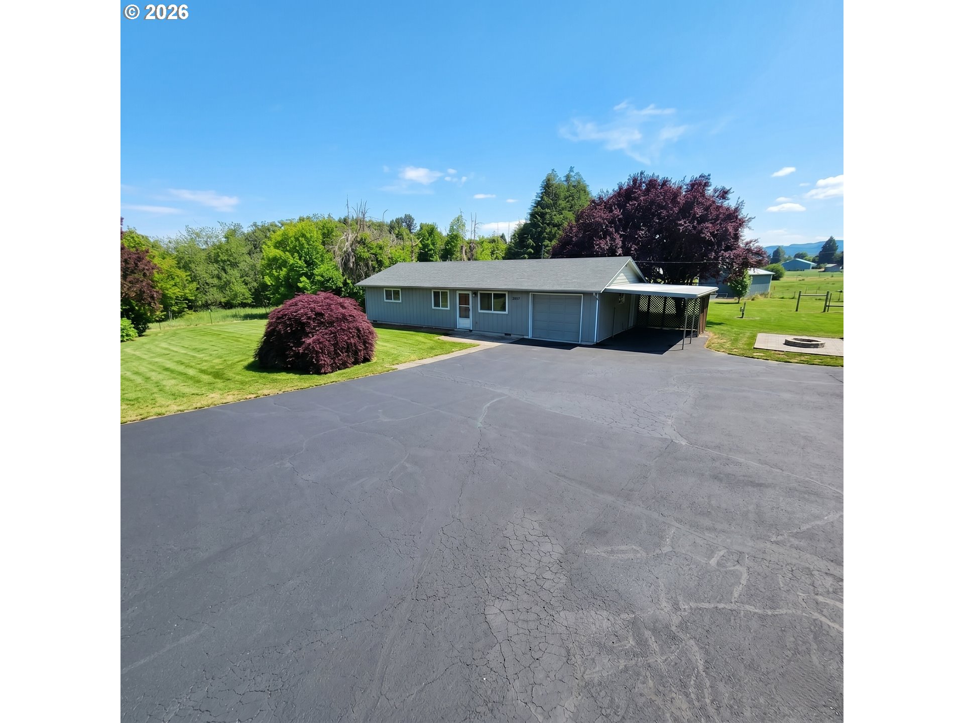 54047 West Lane Road Scappoose, OR 97056 - Photo 1 of 44 a view of a backyard with swimming pool