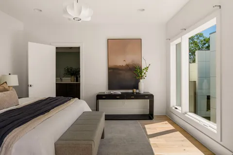a view of a room with wooden floor