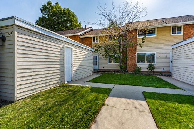 728 400 East Orem, UT 84097 - Photo 5 of 30 Private patio area featuring a concrete pathway and manicured lawn
