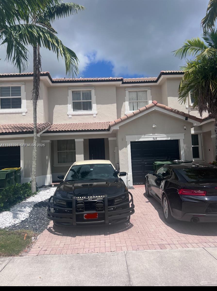 949 Northeast 42nd Avenue Homestead, FL 33033 - Photo 1 of 17 a car parked in front of white house