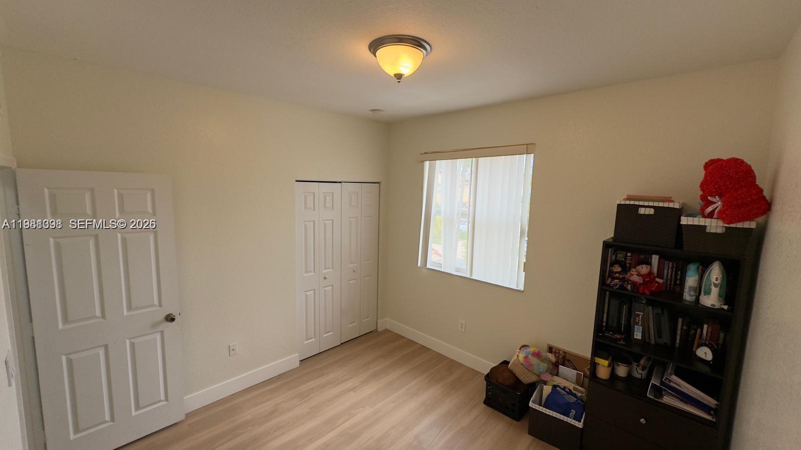 949 Northeast 42nd Avenue Homestead, FL 33033 - Photo 14 of 17 a view of a livingroom with furniture and a window