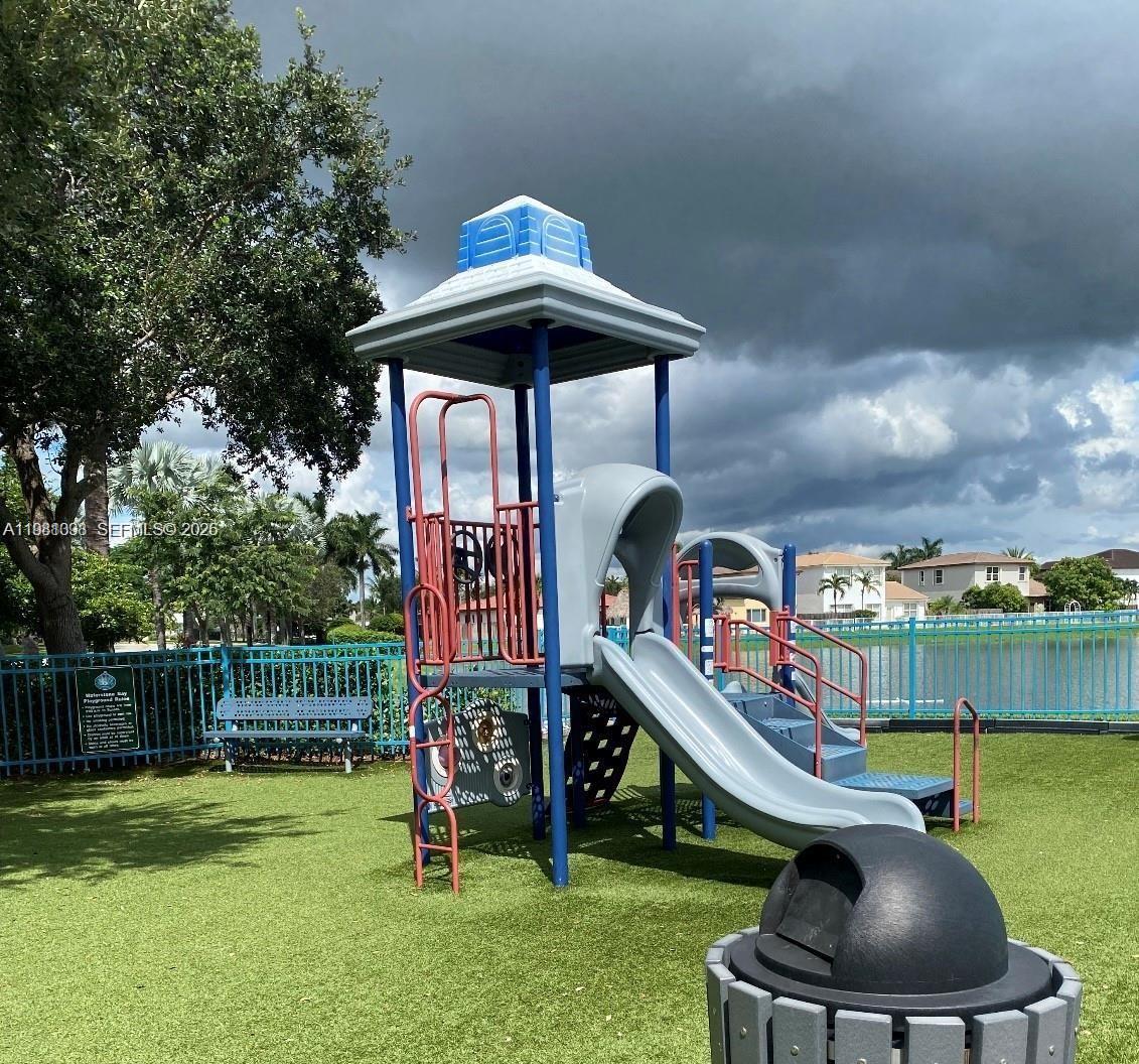 949 Northeast 42nd Avenue Homestead, FL 33033 - Photo 17 of 17 a childrens park with lots of swings and slides