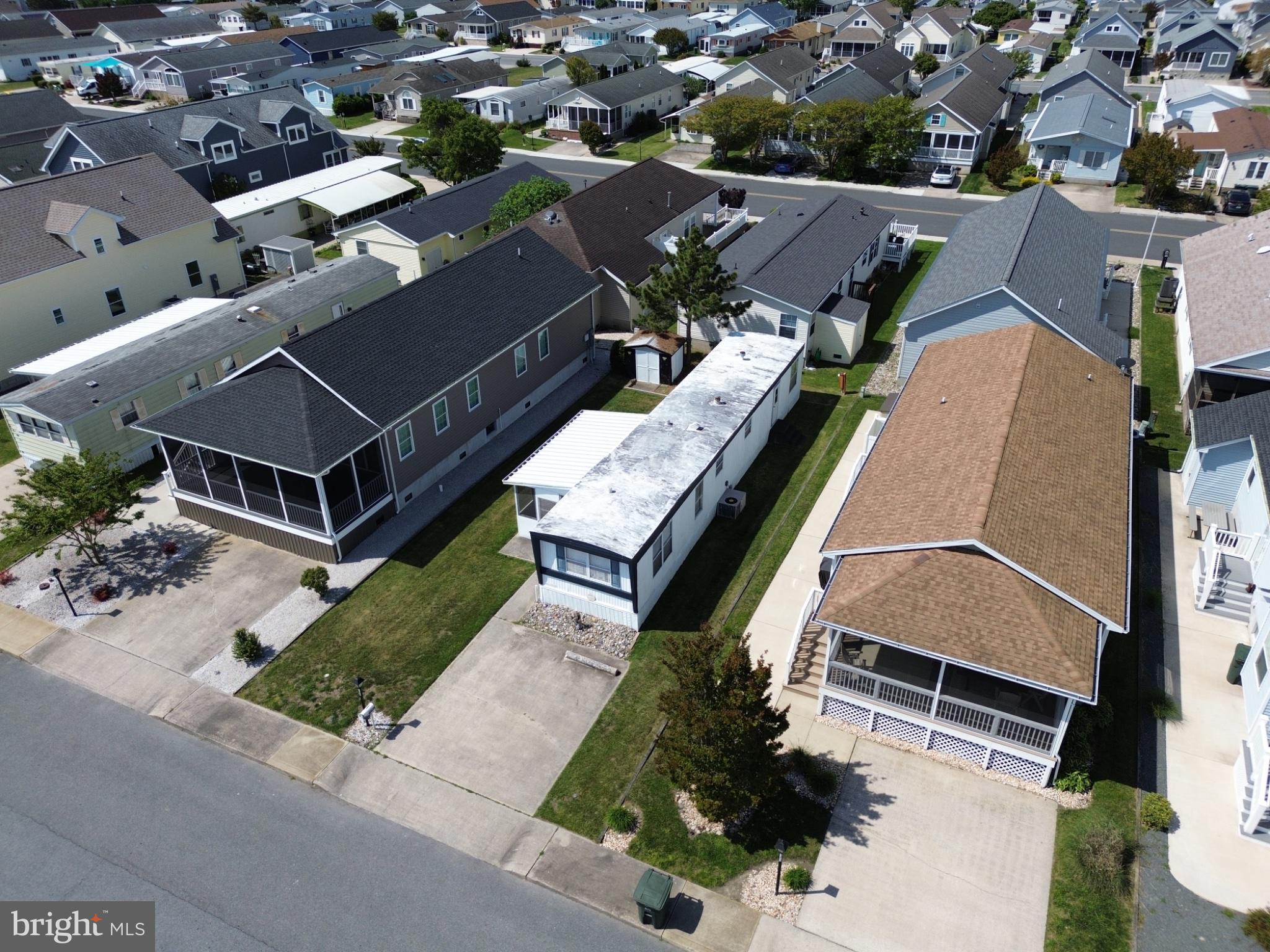163 Clamshell Road Ocean City, MD 21842 - Photo 3 of 18 an aerial view of a house with a garden