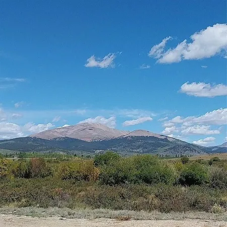a view of a mountain with sunset view