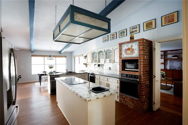 a kitchen with cabinets and stainless steel appliances