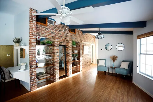 a living room with furniture and a large window