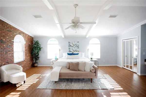 a living room with furniture and wooden floor