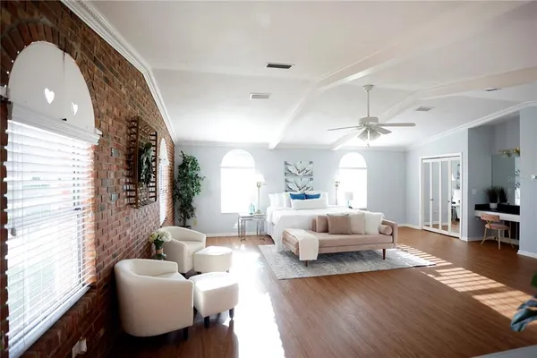 a view of a dining room with furniture and wooden floor