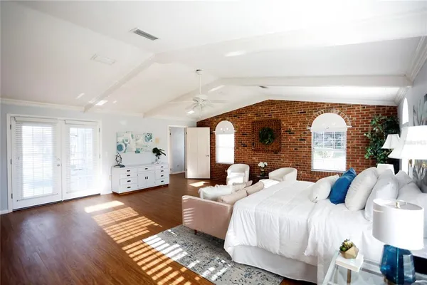 a bathroom with a granite countertop sink a mirror a vanity and a shower