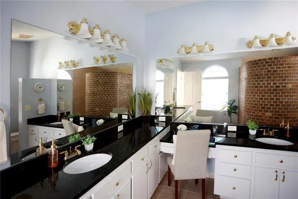 a view of a kitchen with wooden floor and a cabinet
