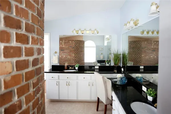 a view of a big room with closet and a chandelier fan