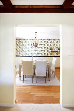 a view of a living room and floor to ceiling window