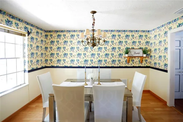 a dining room with furniture and window