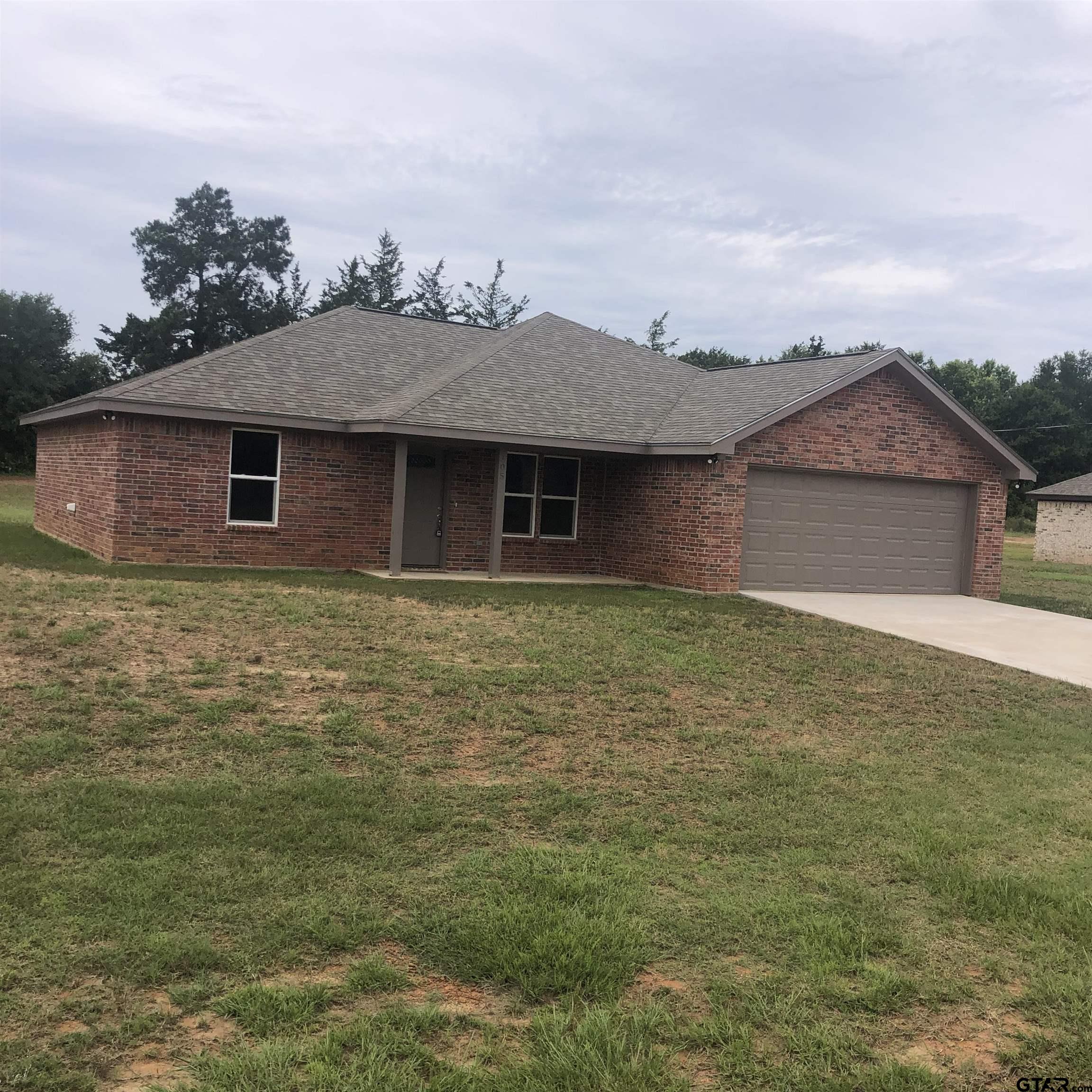 105 Meadows Lane Maud, TX 75567 - Photo 16 of 19 a front view of a house with a garden