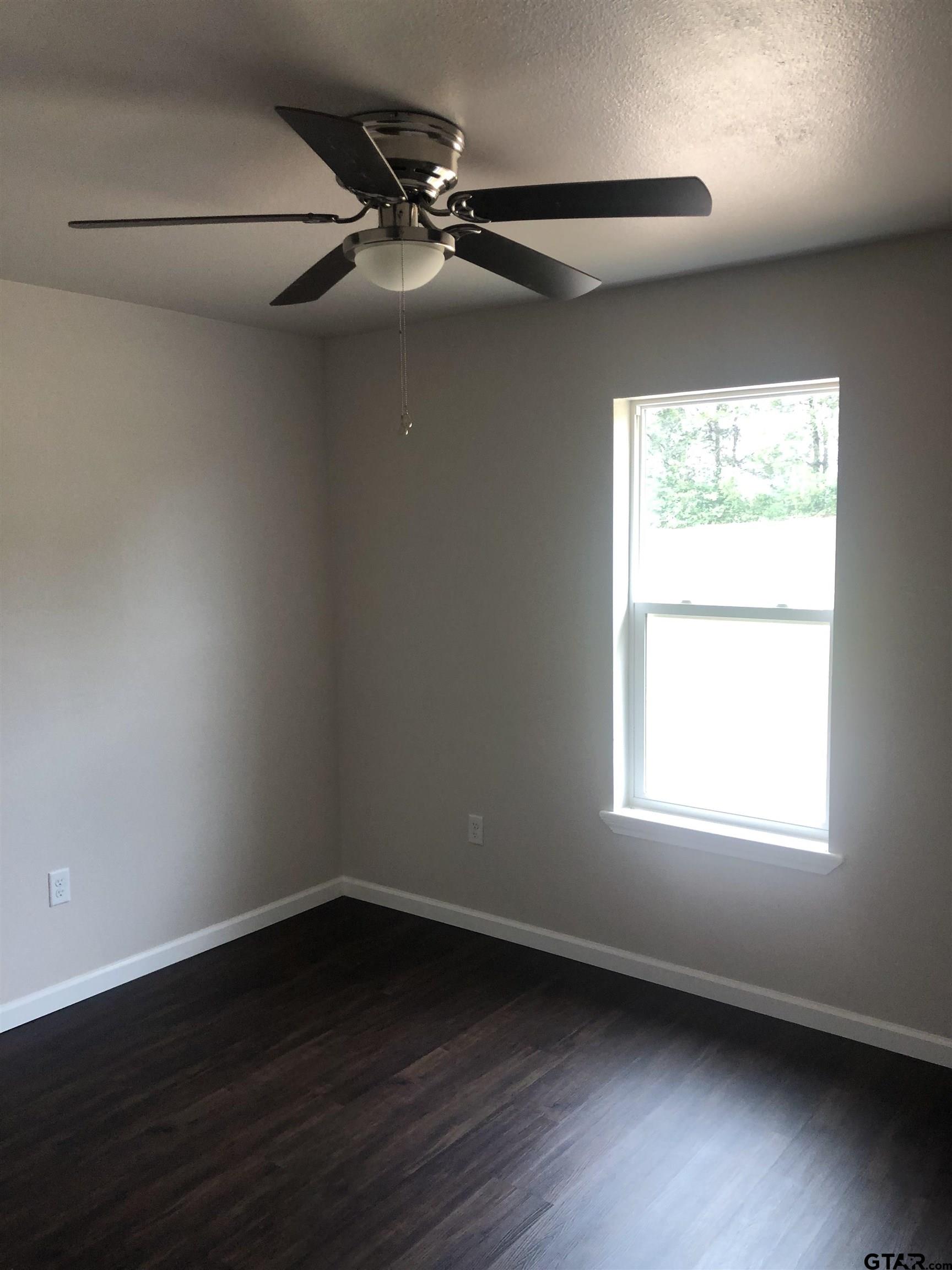 105 Meadows Lane Maud, TX 75567 - Photo 9 of 19 an empty room with a window