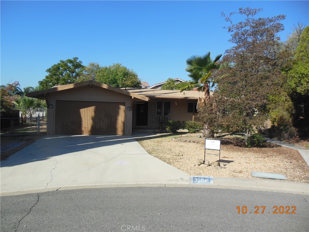 30041 Rim Rock Place Canyon Lake, CA 92587 - Photo 1 of 1 a front view of a house with a yard