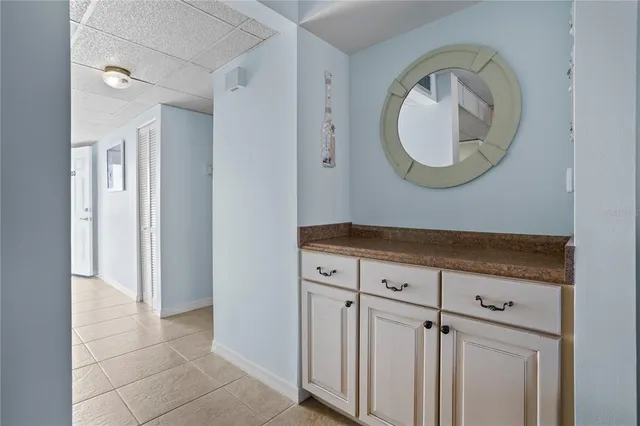 a view of a mirror with cabinets
