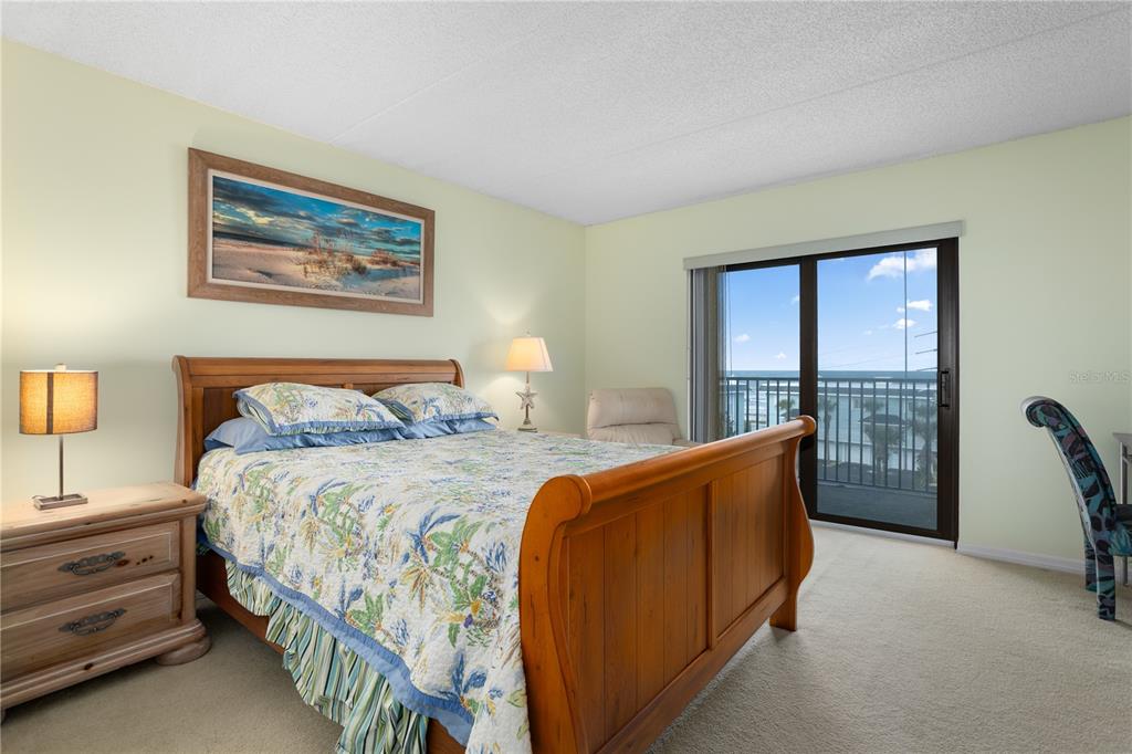 30 Inlet Harbor Road, Unit 5030 Ponce Inlet, FL 32127 - Photo 28 of 52 a bed room with a bed and a large window