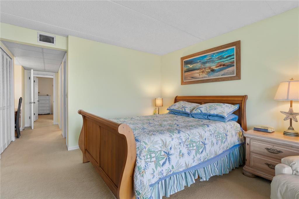 30 Inlet Harbor Road, Unit 5030 Ponce Inlet, FL 32127 - Photo 29 of 52 a bedroom with a bed and a lamp