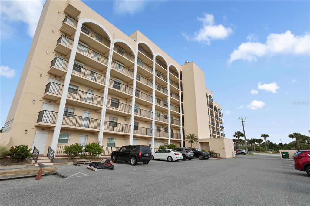 30 Inlet Harbor Road, Unit 5030 Ponce Inlet, FL 32127 - Photo 40 of 52 a view of a cars parked in front of a building
