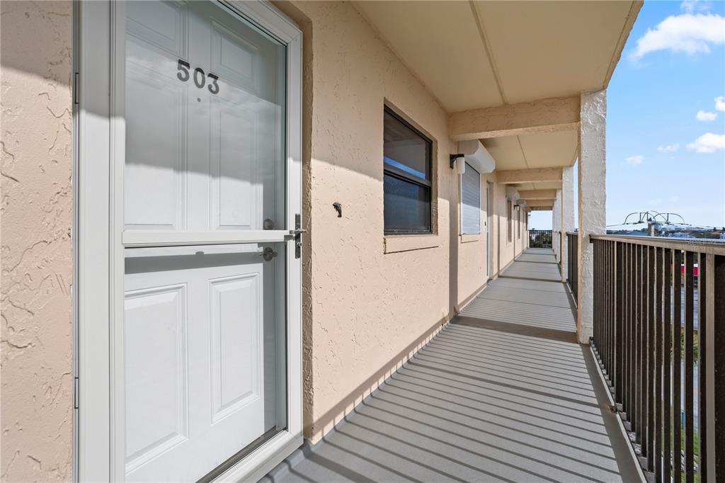30 Inlet Harbor Road, Unit 5030 Ponce Inlet, FL 32127 - Photo 7 of 52 a view of a hallway with wooden floor