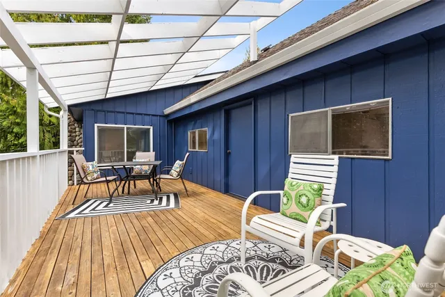 a view of a chair and table in the balcony