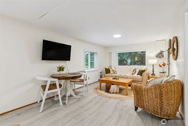 a spacious bedroom with a bed and a couch