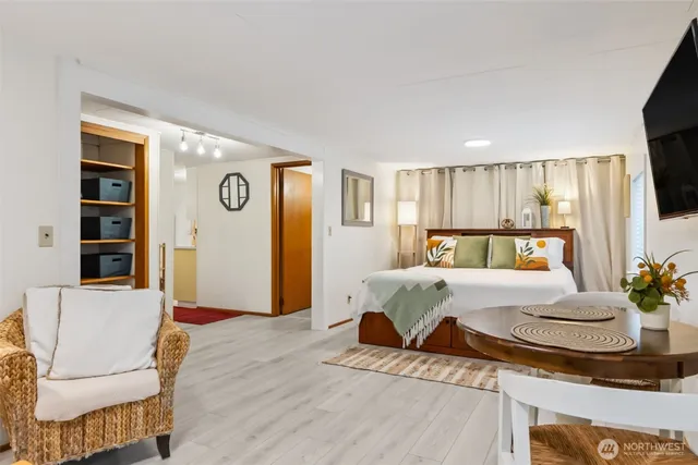 a bedroom with a bed and window