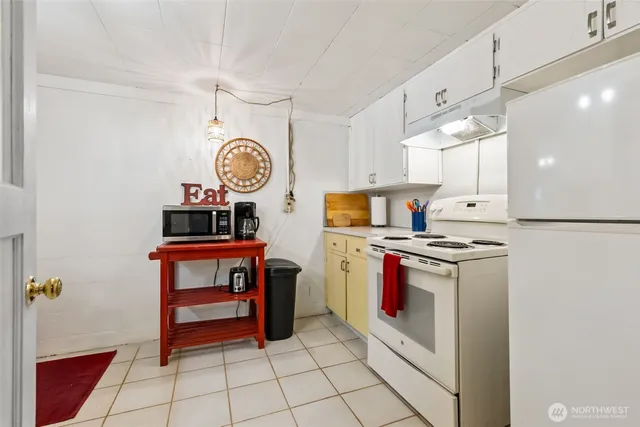 a bathroom with a sink mirror and vanity