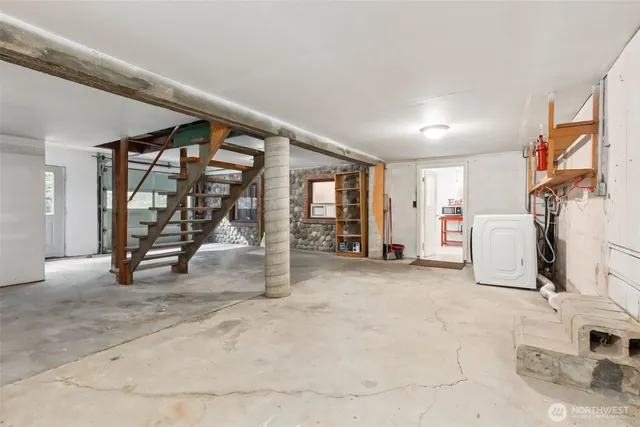 a view of an empty room with stairs