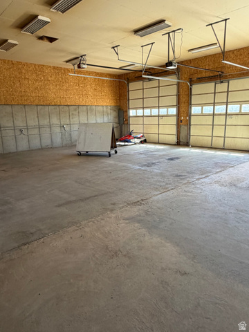 4458 East Glencoe Road Preston, ID 83263 - Photo 27 of 46 Expansive concrete flooring in a large utility space with two overhead doors