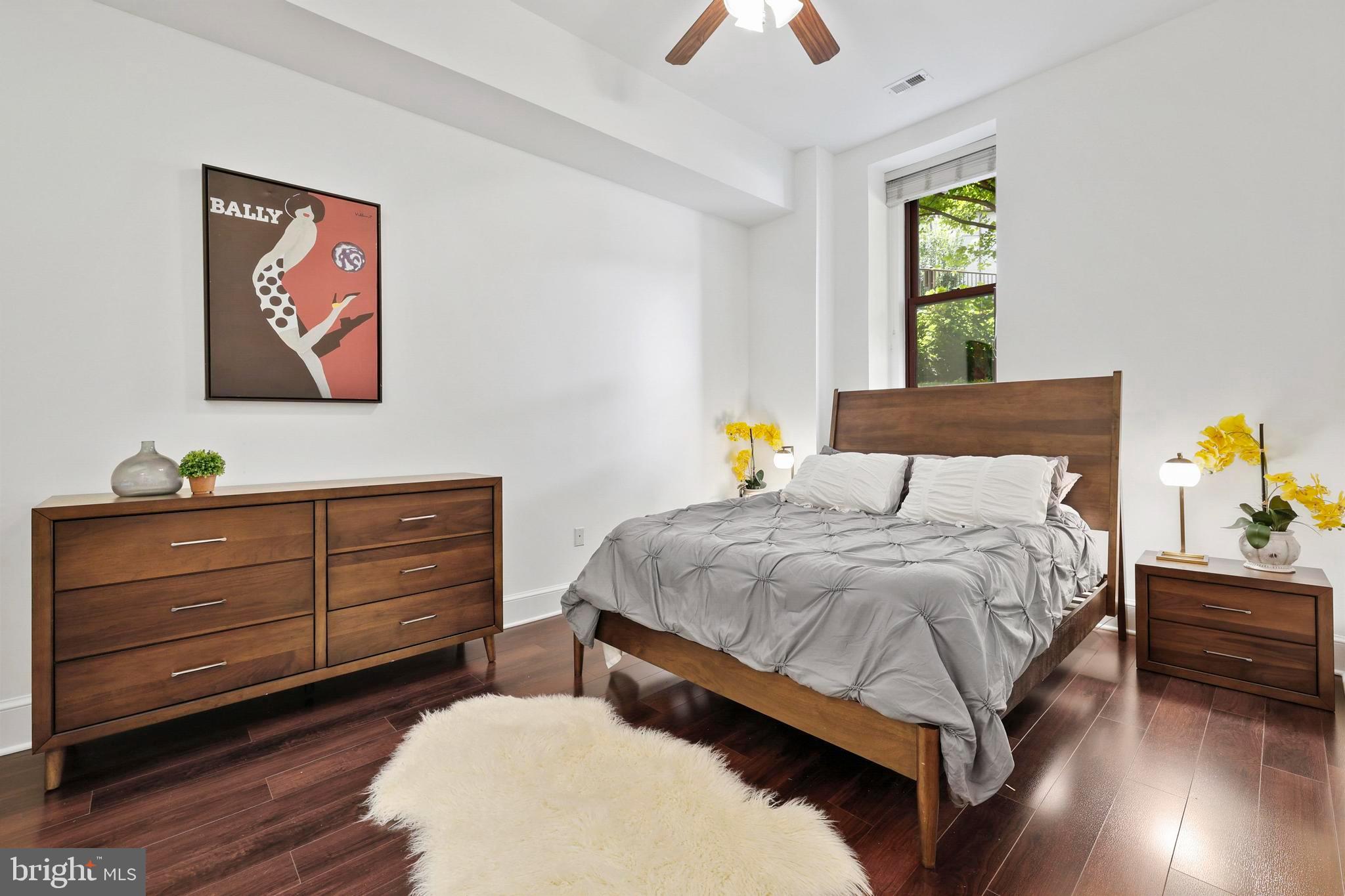 9610 Dewitt Drive, Unit BB03 Silver Spring, MD 20910 - Photo 11 of 28 a bedroom with a bed and a window