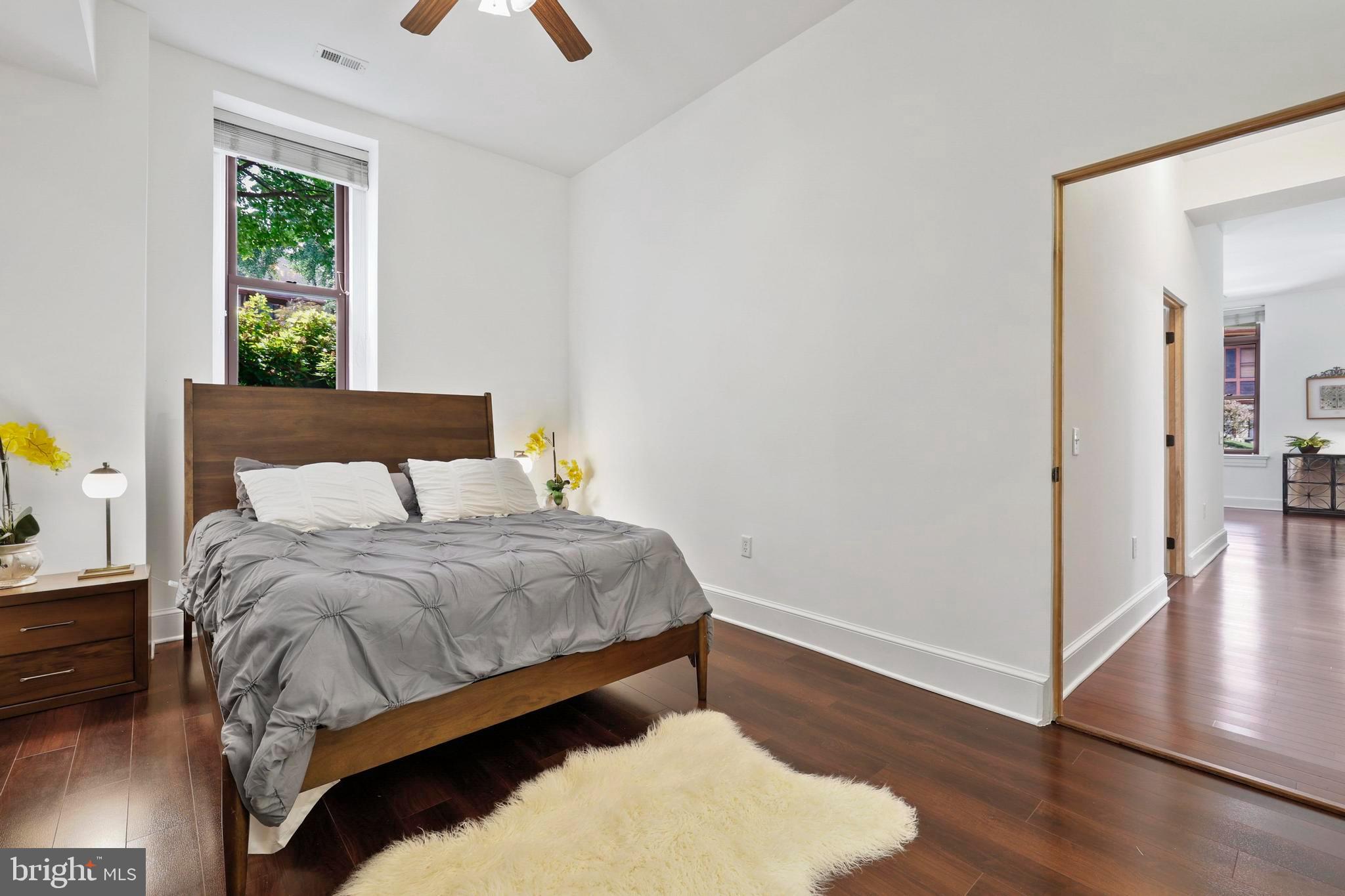 9610 Dewitt Drive, Unit BB03 Silver Spring, MD 20910 - Photo 12 of 28 a bedroom with a bed and a window