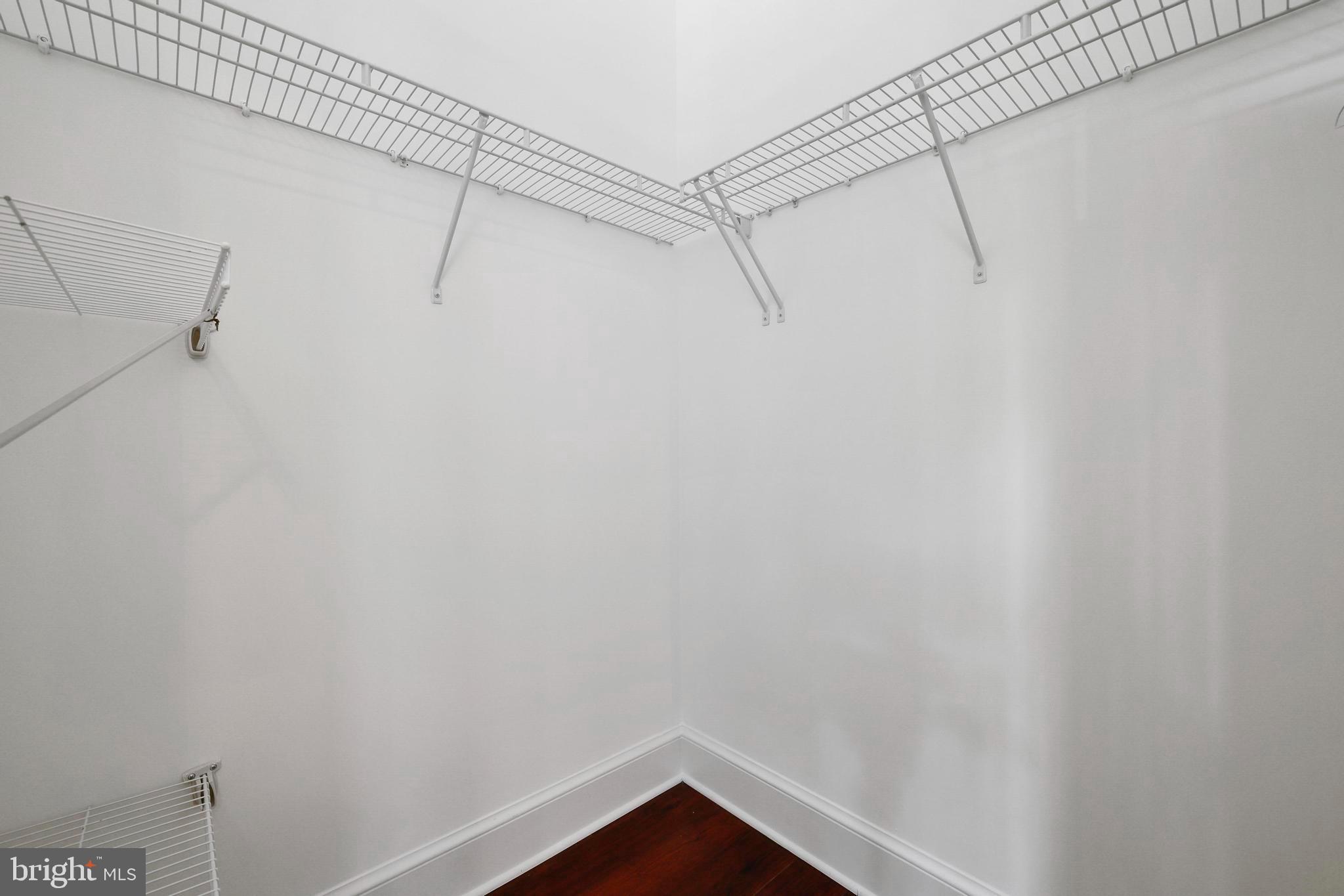 9610 Dewitt Drive, Unit BB03 Silver Spring, MD 20910 - Photo 14 of 28 a view of a room with racks on the wall