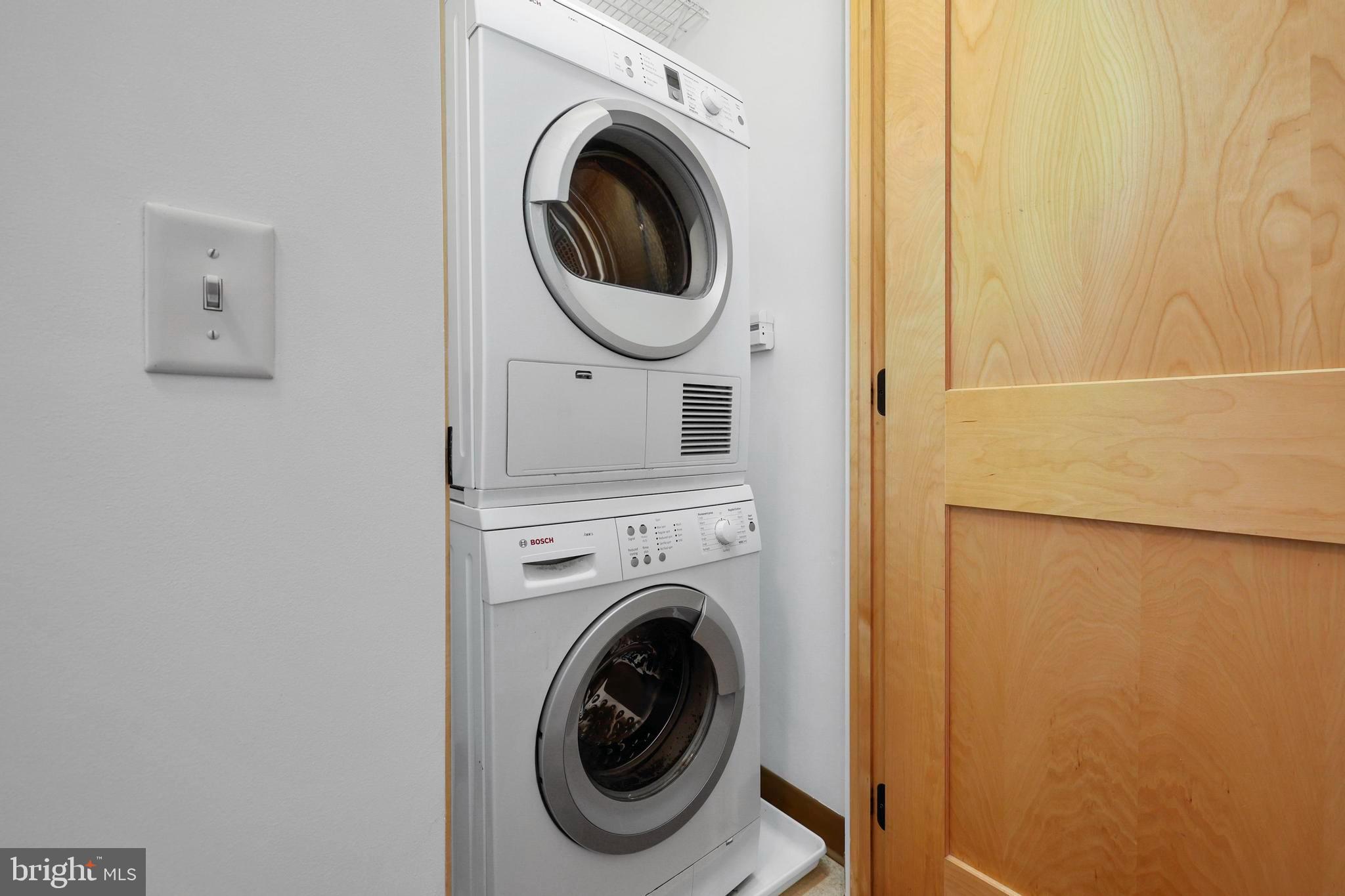 9610 Dewitt Drive, Unit BB03 Silver Spring, MD 20910 - Photo 19 of 28 a utility room with dryer and washer