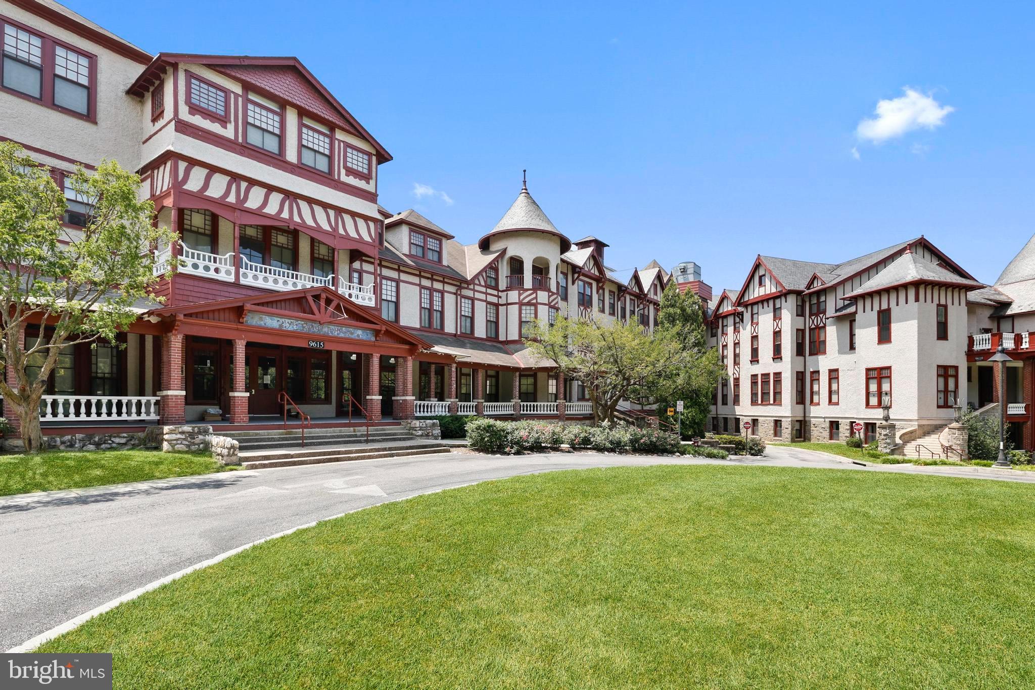 9610 Dewitt Drive, Unit BB03 Silver Spring, MD 20910 - Photo 20 of 28 a front view of a building with a yard